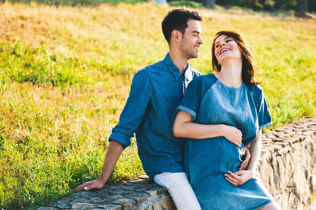 Young Caucasian Man Hugging Pregnant Wife