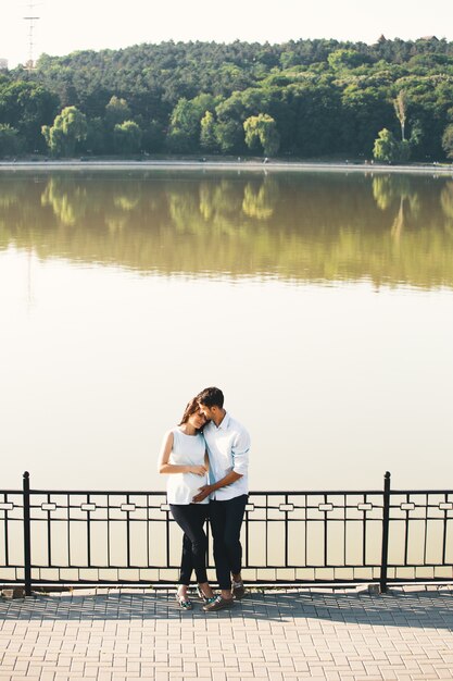 Young Caucasian Man Hugging Pregnant Wife