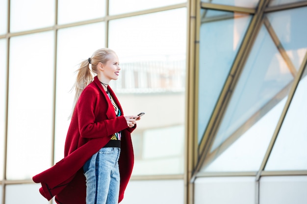 Young caucasian woman walking outdoors.