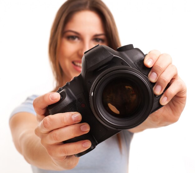 Young caucasian woman with camera 