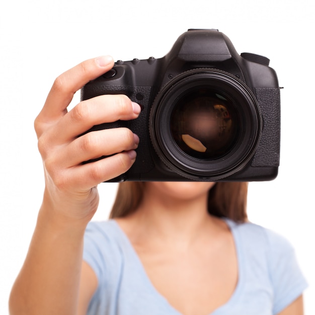 Young caucasian woman with camera 