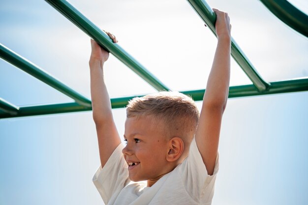 Young child having fun at the outdoors playground