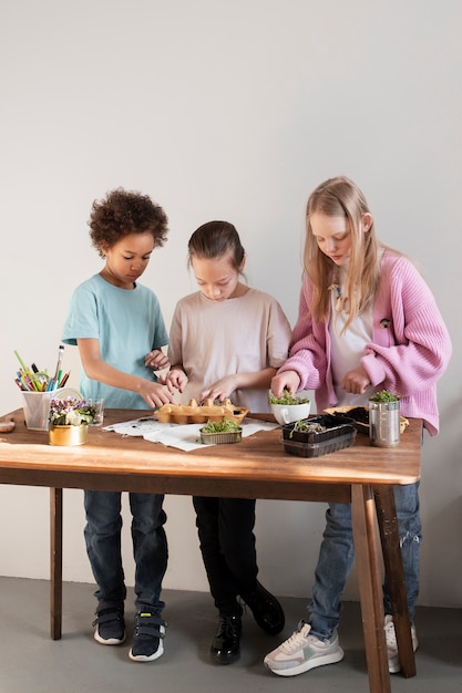 Young child making diy project from upcycled materials