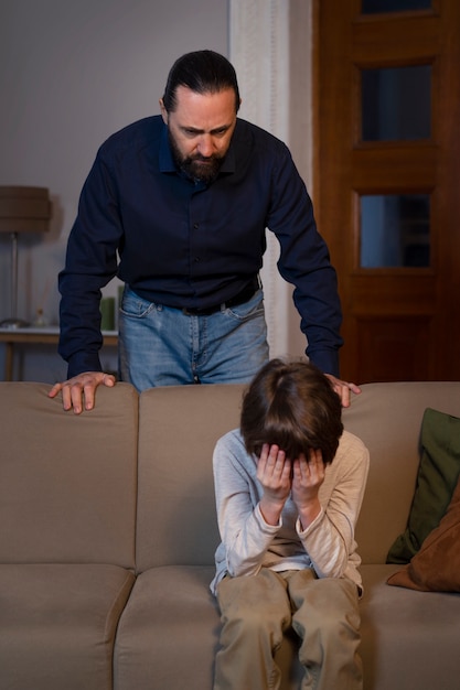 Free photo young child suffering from abuse by parent at home