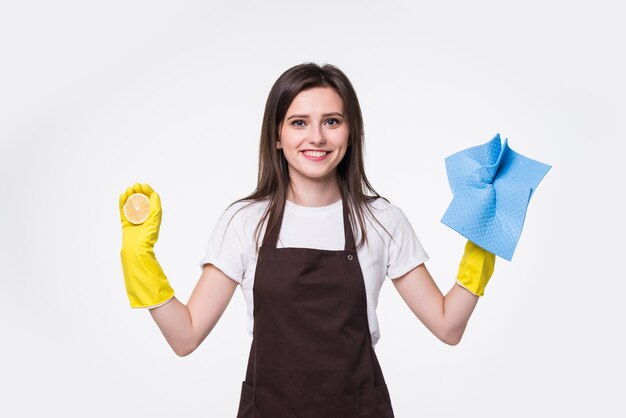 Young cleaning woman standing and holding sponge against