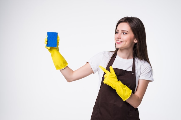 Young cleaning woman standing and holding sponge