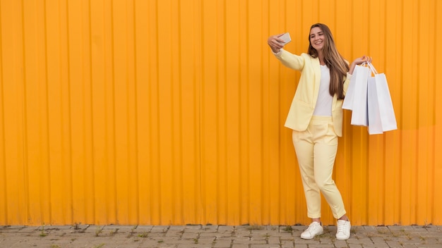 Free photo young client wearing yellow clothes copy space