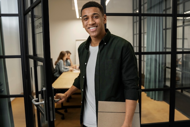 Young co worker spending time in office