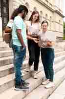 Free photo young colleagues studying together for a college exam