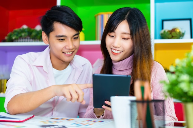 Young colleagues working together at modern office