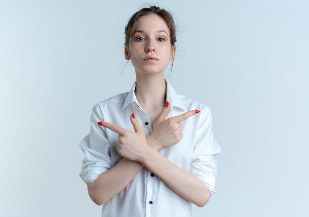 young confident blonde russian girl points at both sides