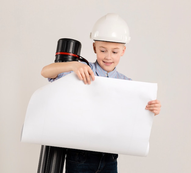 Free photo young construction worker holding project