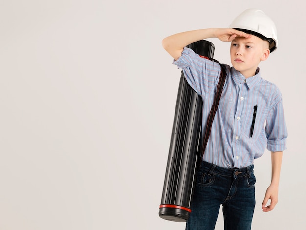 Young construction worker looking away