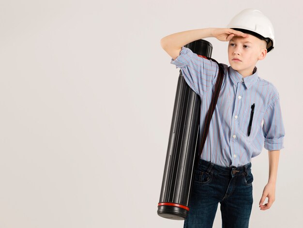 Young construction worker looking away