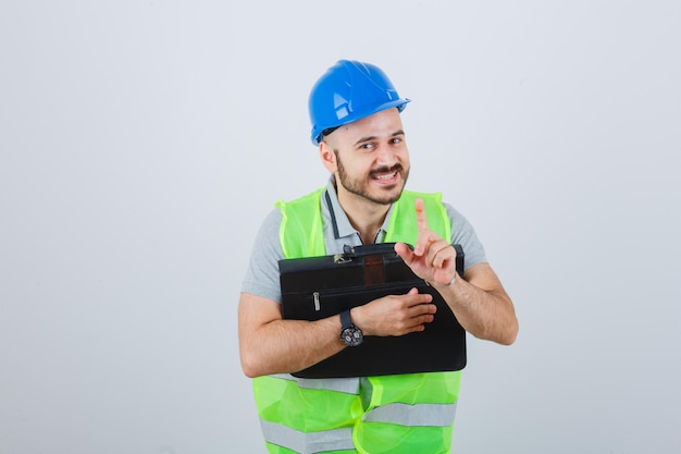 Young construction worker wearing a safety helmet