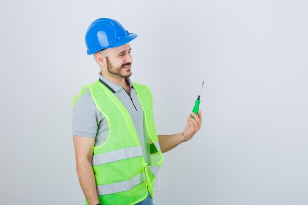 Young construction worker wearing a safety helmet