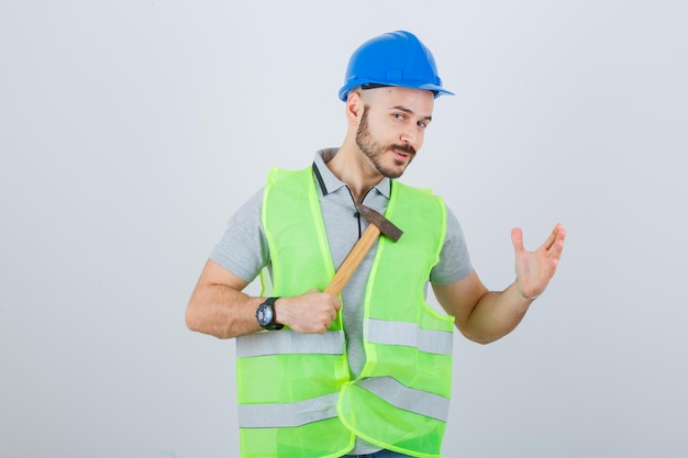 Young construction worker wearing a safety helmet