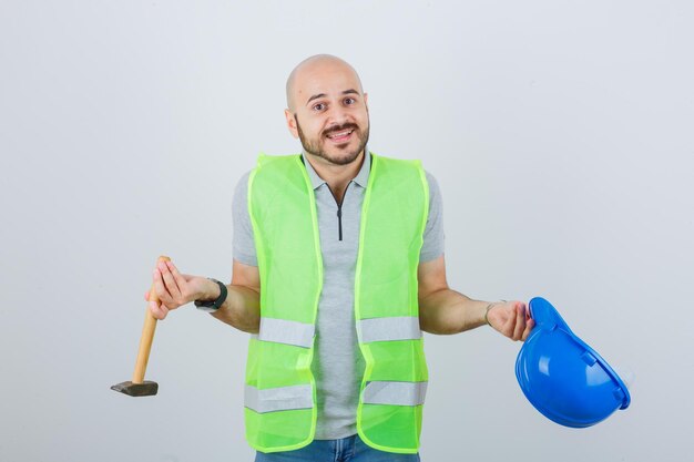 Young construction worker wearing a safety helmet