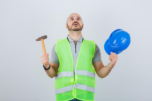 Young construction worker wearing a safety helmet