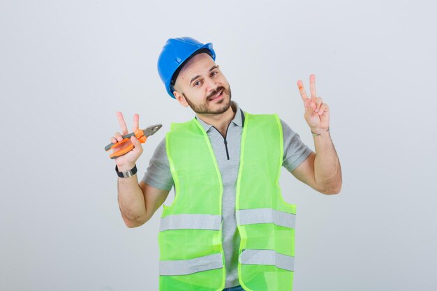 Young construction worker wearing a safety helmet