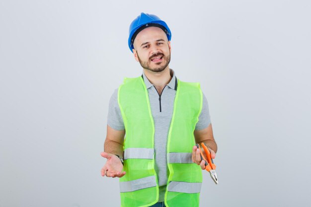 Young construction worker wearing a safety helmet