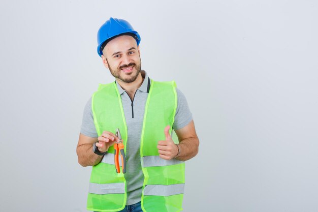 Young construction worker wearing a safety helmet