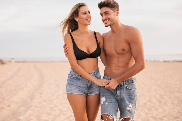 Young couple at beack walking