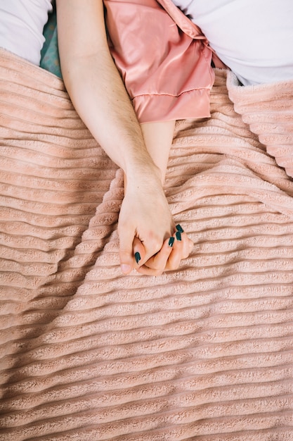 Free photo young couple in bed in the morning