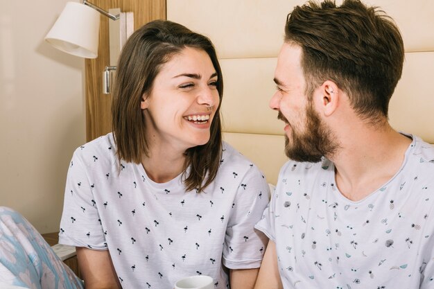 Free photo young couple in bed in the morning