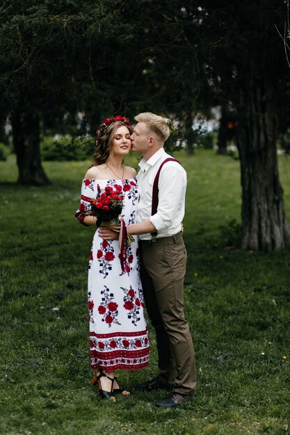 Young  couple in a blooming garden