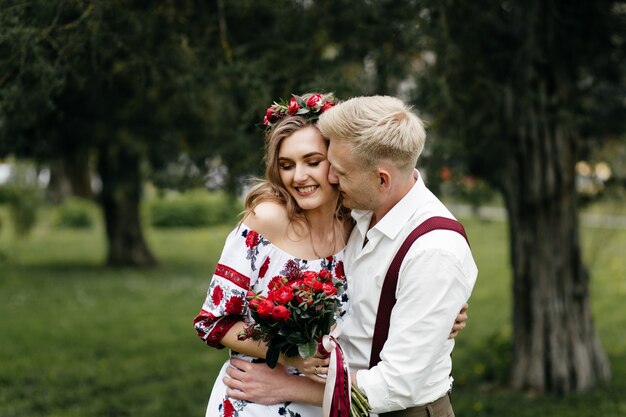 Young  couple in a blooming garden