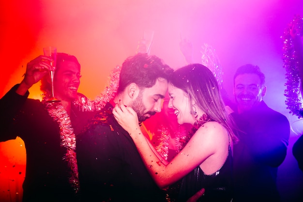 Young couple celebrating in club