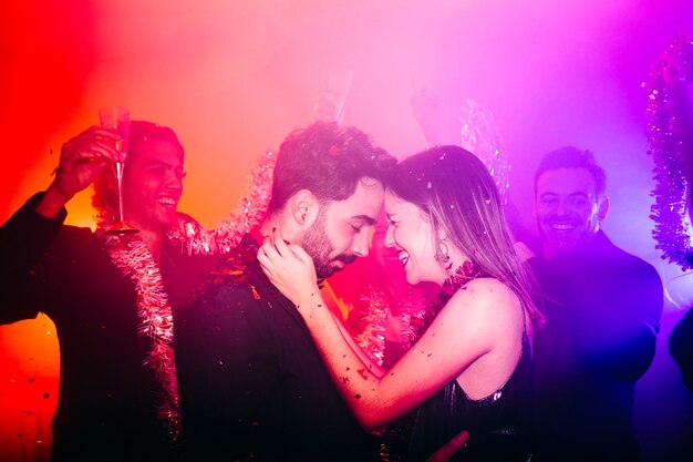 Young couple celebrating in club