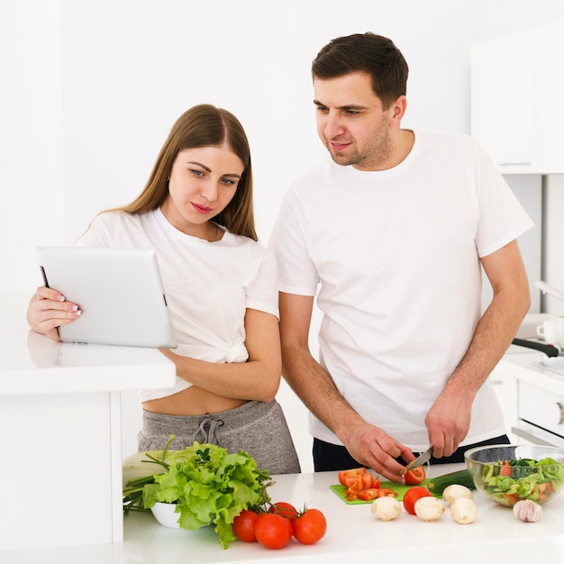 Young couple checking receipe