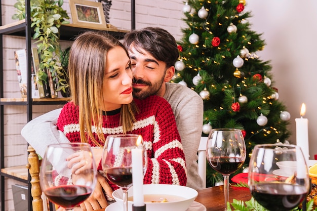 Free photo young couple at christmas dinner