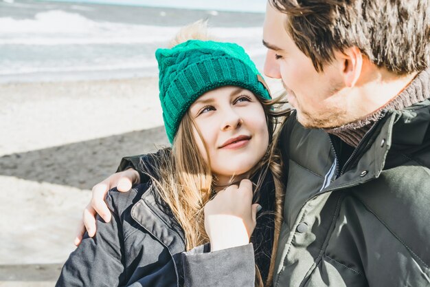 young couple of the cold Baltic sea