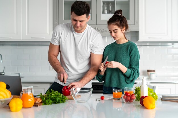 Young couple cooking at home