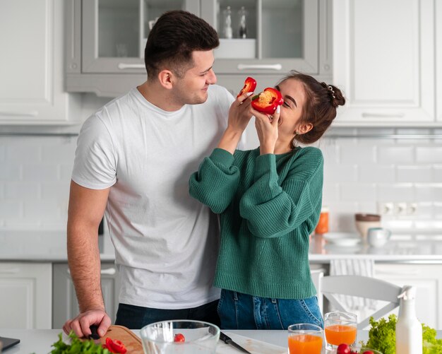 Young couple cooking at home