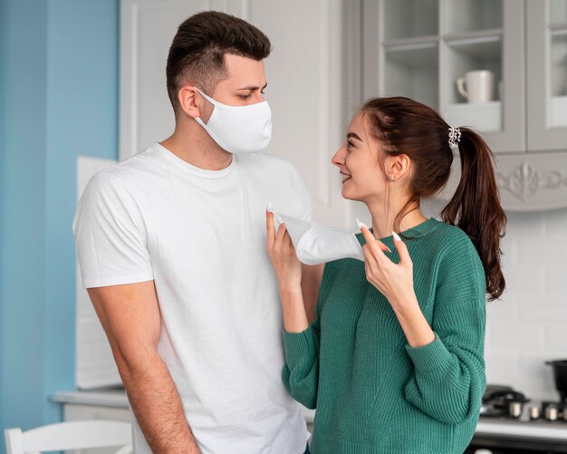 Young couple cooking at home