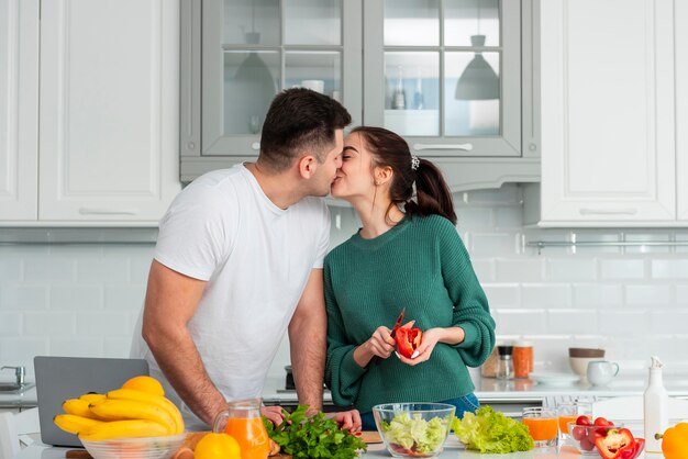 Young couple cooking at home