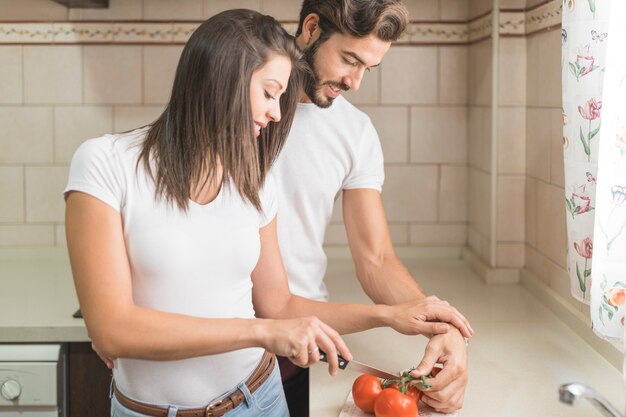 Young couple cooking together