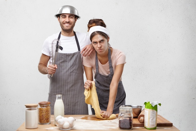 Young couple cooking together