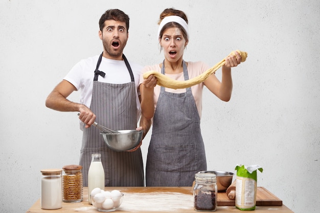 Free photo young couple cooking together