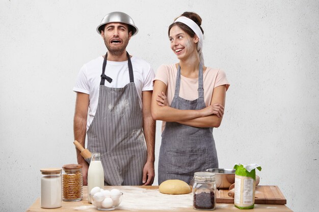 Young couple cooking together