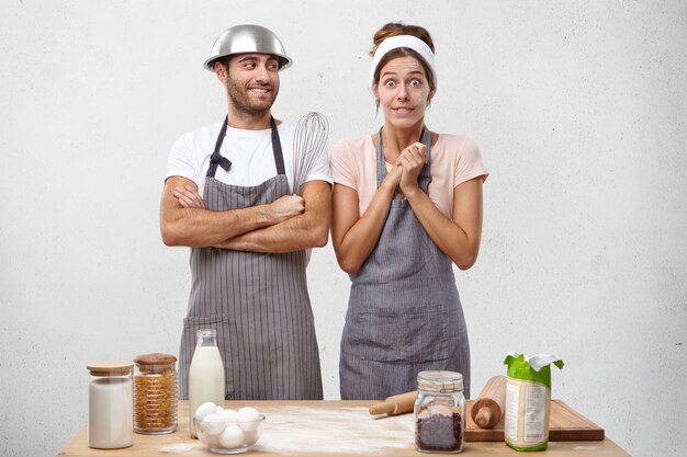 Young couple cooking together