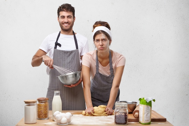 Young couple cooking together