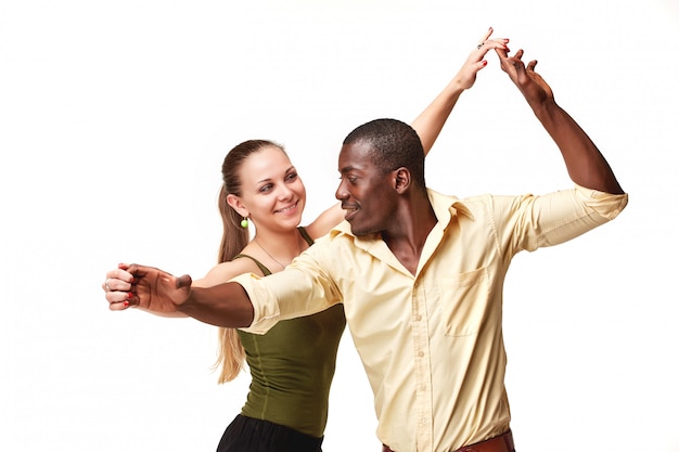 Young couple dances Caribbean Salsa,  shot