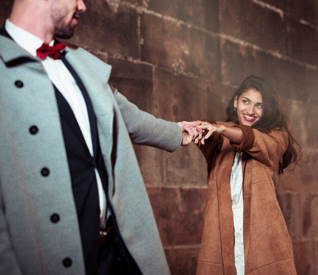 Young couple dancing in street 