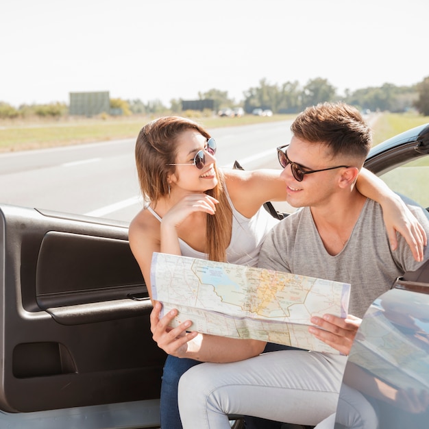 Free photo young couple doing a road trip