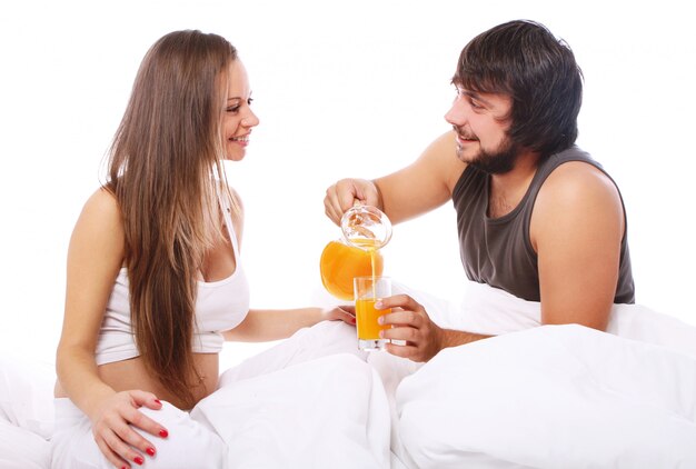 Young couple drinking orange juice